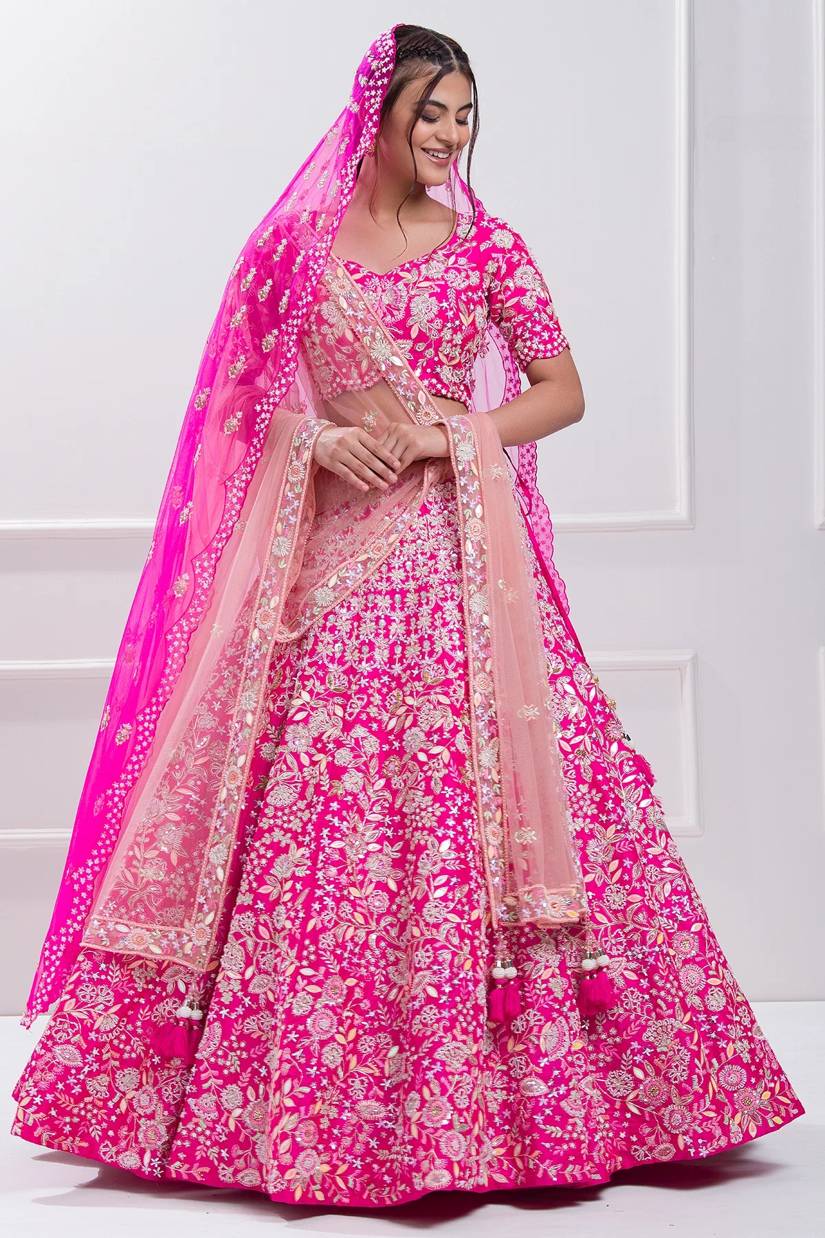 Dazzle on your big day with our breathtaking Hot Pink Sequins Embroidered Raw Silk Bridal Lehenga! 💖 Embrace the elegance of tradition fused with modern glamour. This exquisite piece is designed to make you feel like royalty as you dance into your forever.