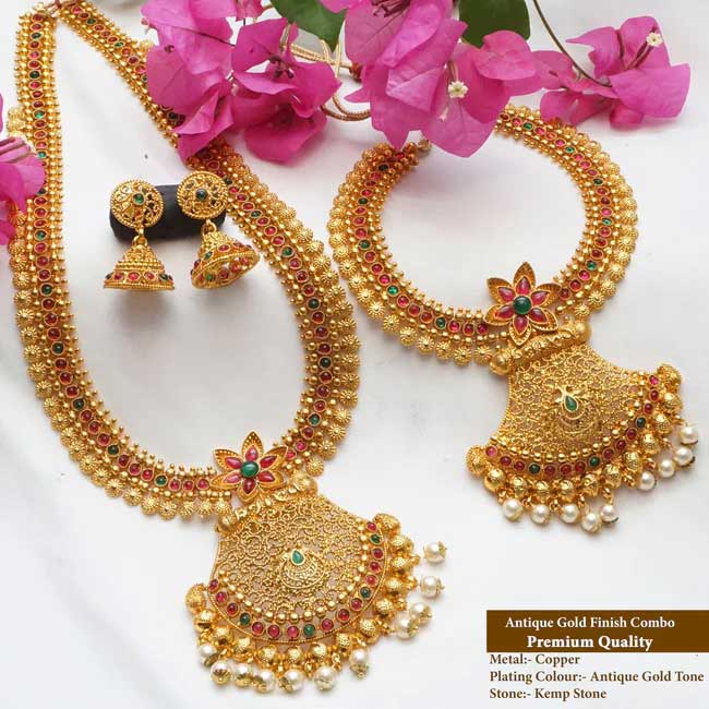 This haram set has a unique design that ties it to its true Indian roots. It has the glorious shine of kempu stone and the special Bandhai stone that come together beautifully with the antique plating.

Stand out from the crowd whenever you wear it, everywhere you wear it. Its unique design and a beautiful structure make it extra special. It�s a must-have in every jewel box.

Product Details
The total length of the Short necklace is 8 Inches (4 inches on both sides).
The total length of the long necklace is 18 Inches (9 inches on both sides).
The height of the earrings is  2.5 cm and the width is  1.5 cm.
Necklace back site adjustable rope is attached.
Earrings lock is a press type.
100% made with love in India
We manufacture, design, and sell all of our jewelry