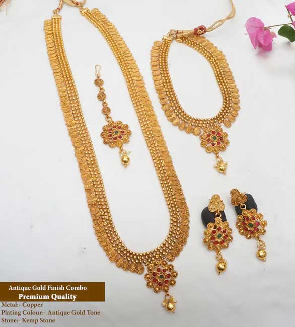 This haram set has a unique design that ties it to its true Indian roots. It has the glorious shine of kempu stone and the special Bandhai stone that come together beautifully with the antique plating.

Stand out from the crowd whenever you wear it, everywhere you wear it. Its unique design and a beautiful structure make it extra special. It�s a must-have in every jewel box.

Product Details
The total length of the Short necklace is 8 Inches (4 inches on both sides).
The total length of the long necklace is 18 Inches (9 inches on both sides).
The height of the earrings is  2.5 cm and the width is  1.5 cm.
Necklace back site adjustable rope is attached.
Earrings lock is a press type.
100% made with love in India
We manufacture, design, and sell all of our jewelry.