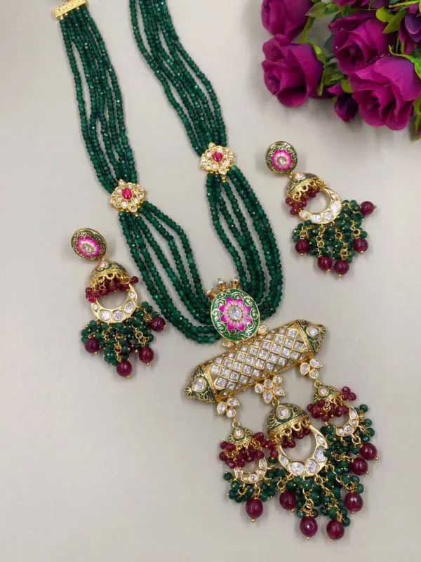 Traditional handcrafted gold plated high-quality Kundan long necklace set from the house of the Gehna Shop.