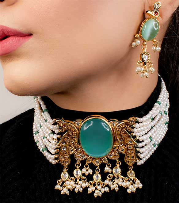Chicasuu presents this elegant 22k gold plated Kundan earrings from its Nayab collection. It is adored by high quality embellishments and natural stones.

Necklace Length : 11 inches
Earring Length : 3 inches
Collection Name : Nayab
Total Weight : 190 gm
Contains : 1 necklace, 1 pair of earrings